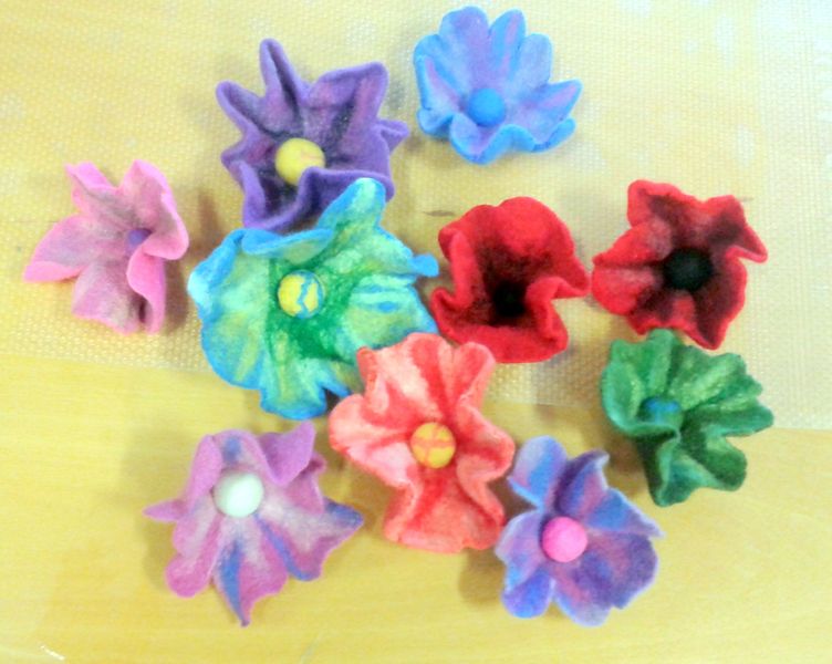 Learn to make wool felt flower brooches at online art and textiles course