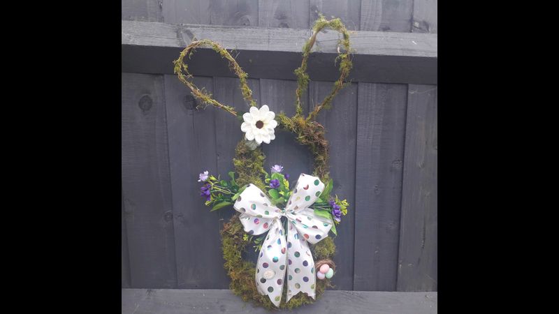 The Easter Bunny Wreath can be displayed outdoors with some protection from the elements