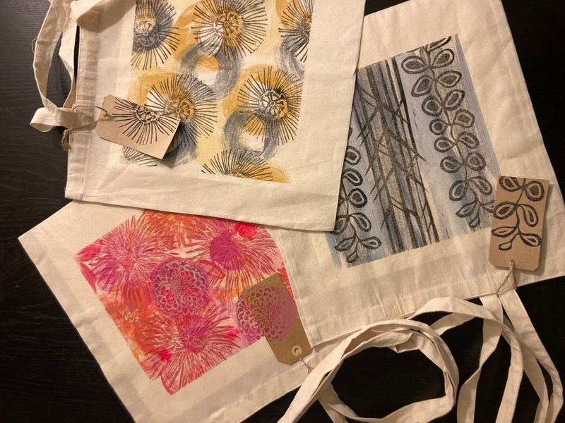 Trio of mono and lino printed tote bags