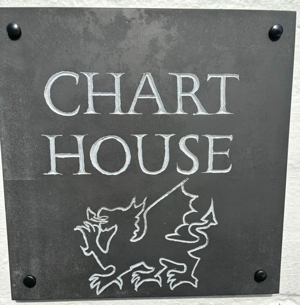 Carved and painted house sign