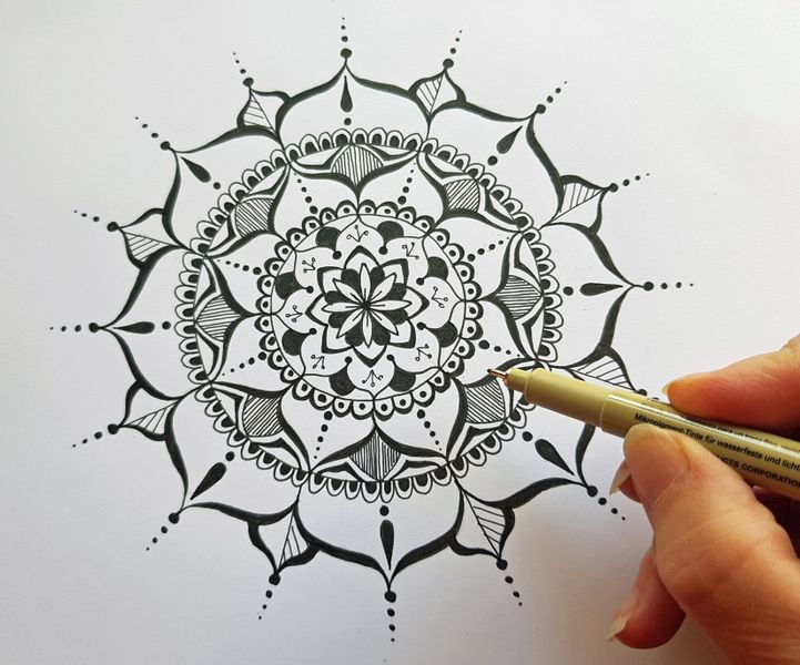 Learn to draw this mandala design.