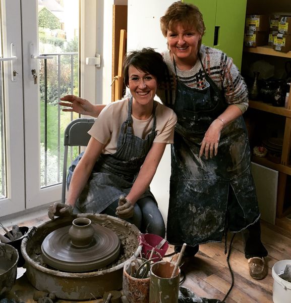Another happy potter having the first try at throwing a pot