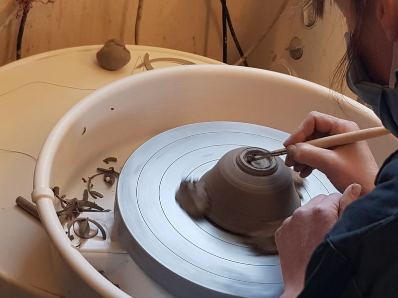 Learning to carve a foot ring on a bowl