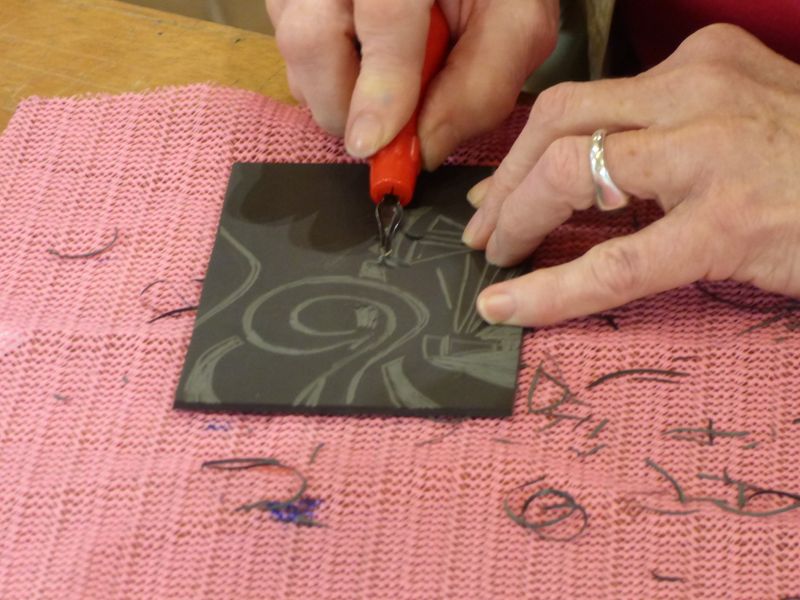 Cutting the lino after creating the design