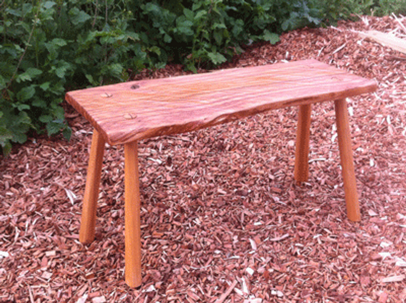 Side table in tiger oak and cherry.