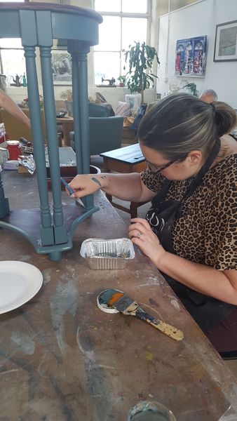 Painting a side table on the Furniture Upcycling workshop
