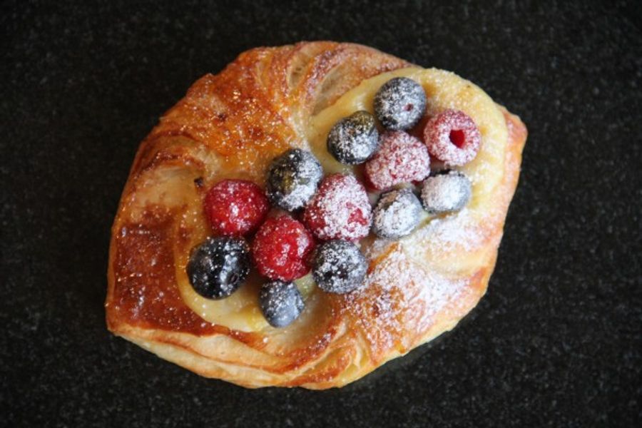 Fresh blueberries in a half-pocket Danish.