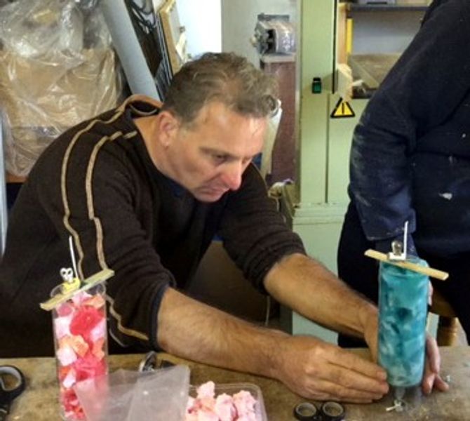 Tutor Rob Aley demonstrates moulding candles
