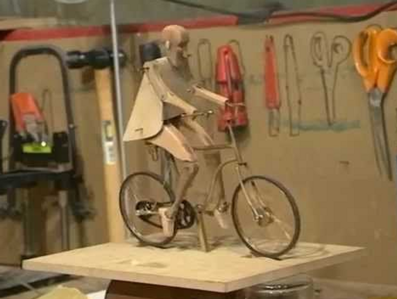 Classic bicycle automaton, where the figure is driven by the bike but the illusion reverses it