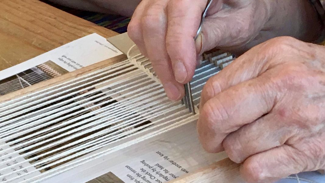 Hands at work - the beginnings of a woven tapestry