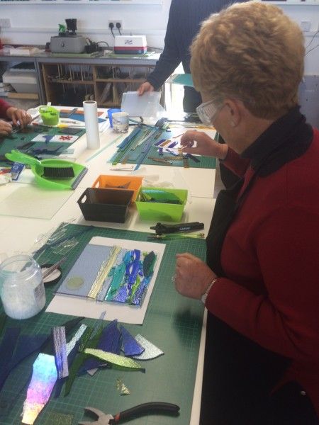 A student preparing her panel on the Glass Fusing Taster Day experience