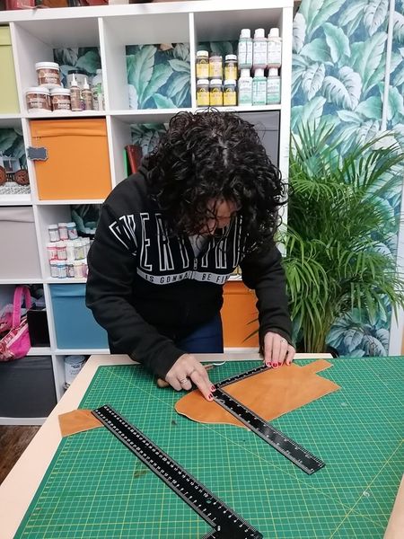 Student making a leather journal
