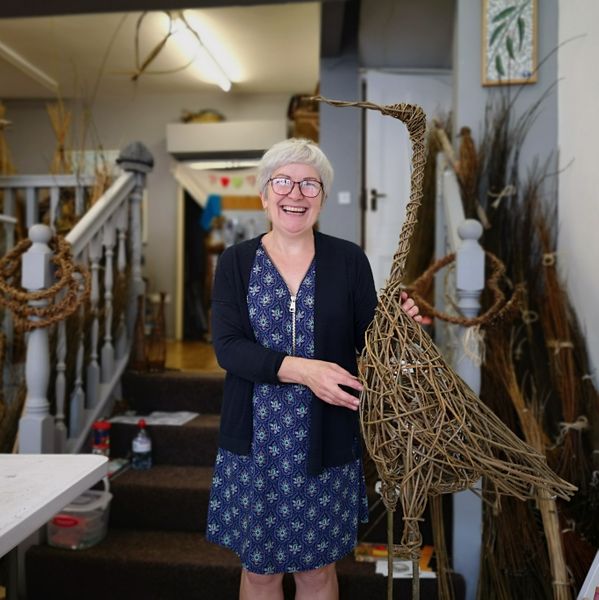 Student weaving heron at Creative with Nature Todmorden West Yorkshire