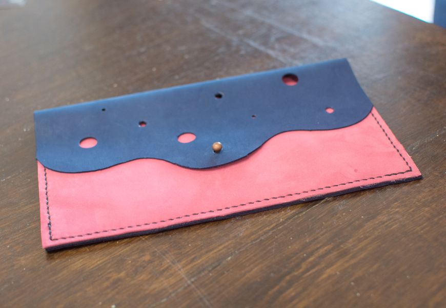 A students handmade leather purse