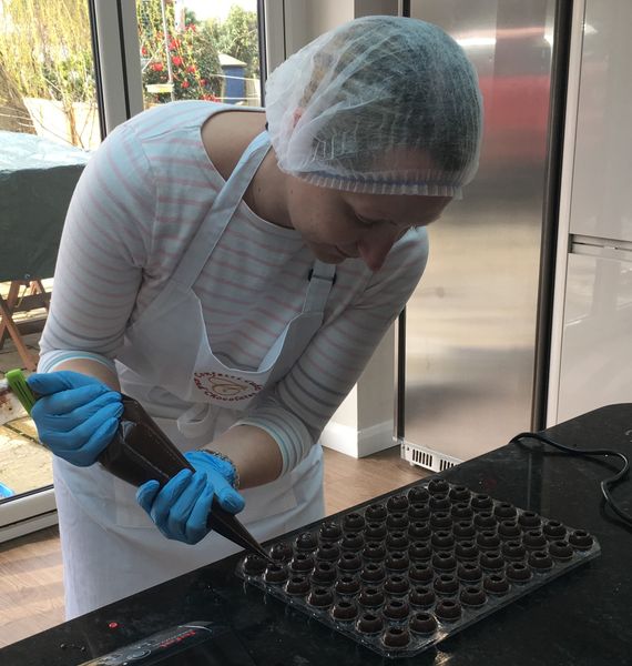 Student filling truffle spheres