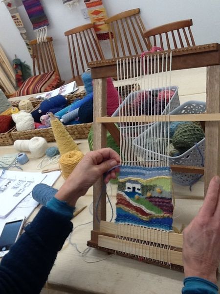 LYL Student weaving on loom