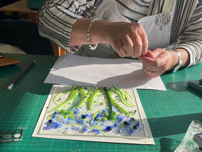 a student working on a beautiful Agapanthus design