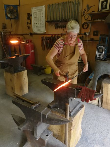 Hard at work on the anvil! Blacksmithing course Shropshire