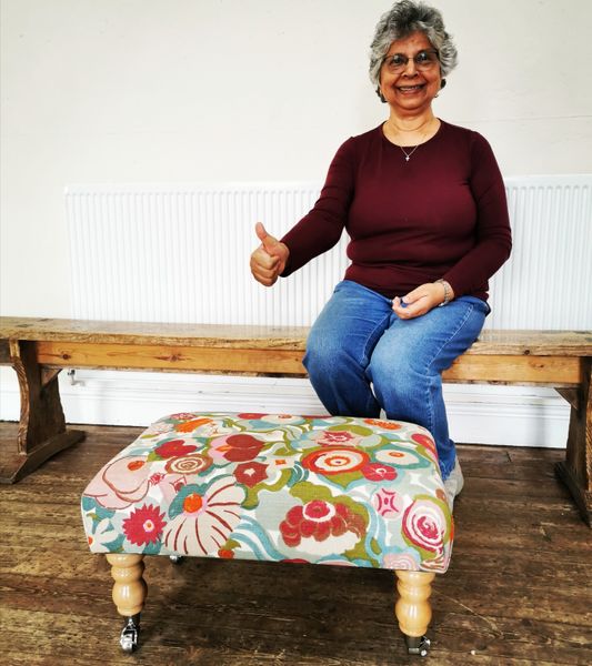 Happy student with her new medium sized footstool