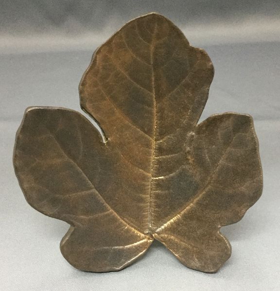Gold glazed fig leaf rolled into clay