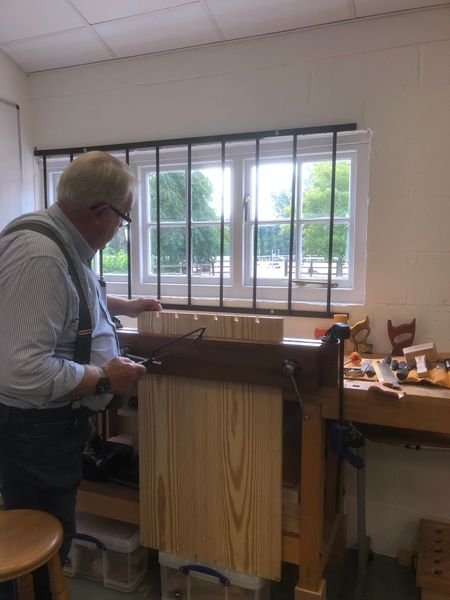 Learning to cut dovetails when making a traditional tool chest