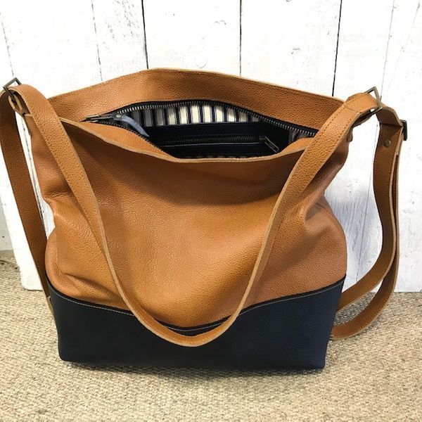 Helena's tan and navy leather tote/rucksack bag