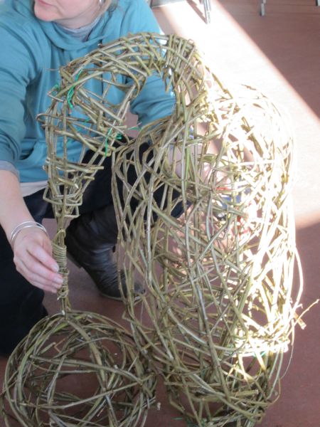 student making willow penguin frame completed