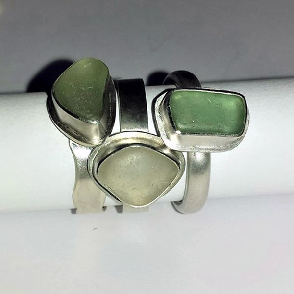 A collection of sea glass rings.