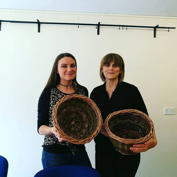 Mother and daughter completed bread/fruits baskets