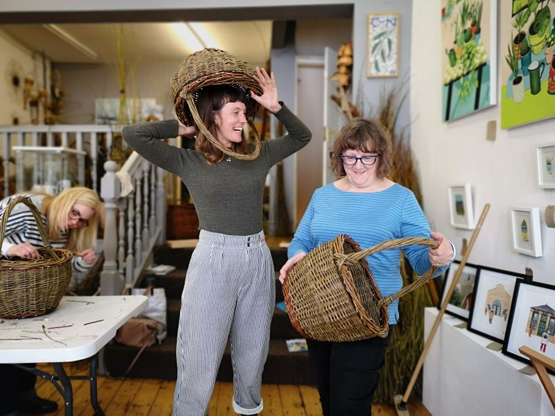 mother and daughter completed round shopping baskets