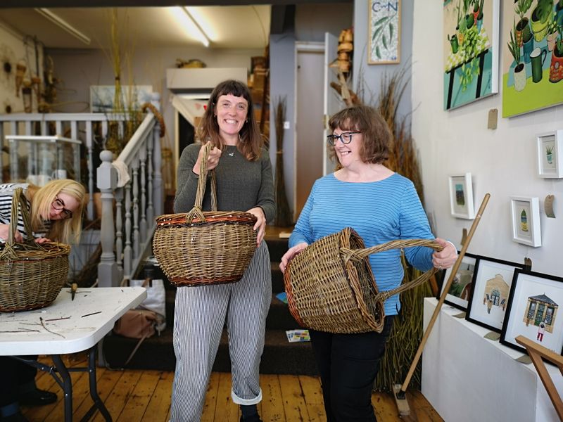 Mother and daughter completed round shopping baskets