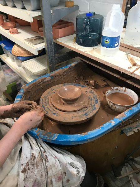 Throwing on potters wheel