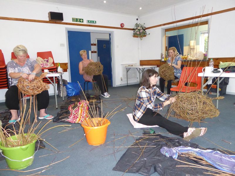Students making willow pigs