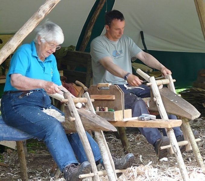 Shaping the stool legs and rungs with draw-knives