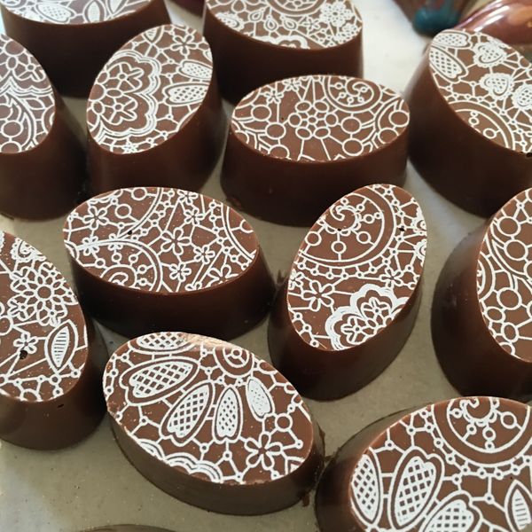 Hand moulded chocolates with transfer finish.