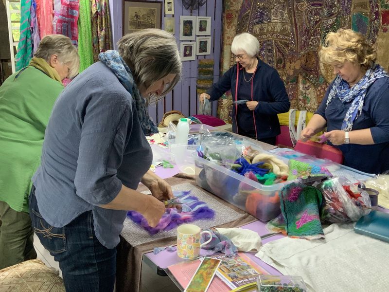 Group of friends immersed in felt-making