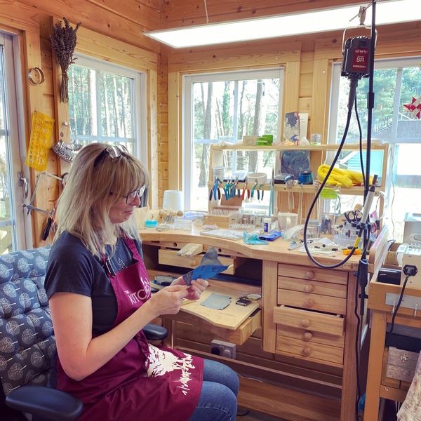 Sanding a silver ring using a pendant motor