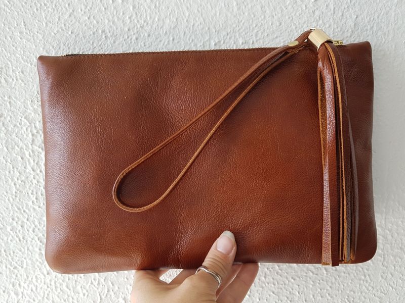 Finished leather clutch with handle