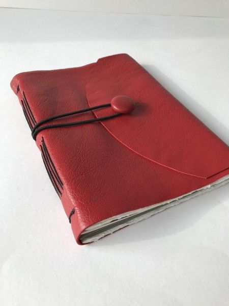 Upcycled leather journal using the button from the original 1970's coat