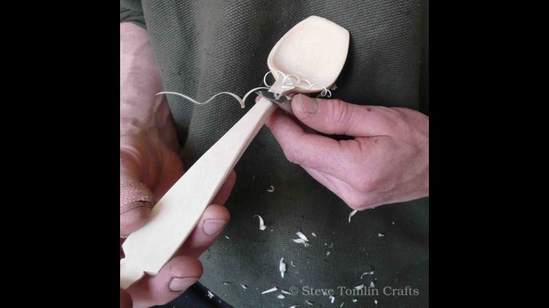 Careful sharp knife work shaping the handle