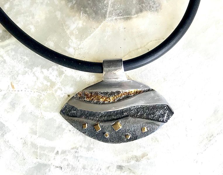 Patinated and gilded pendant.