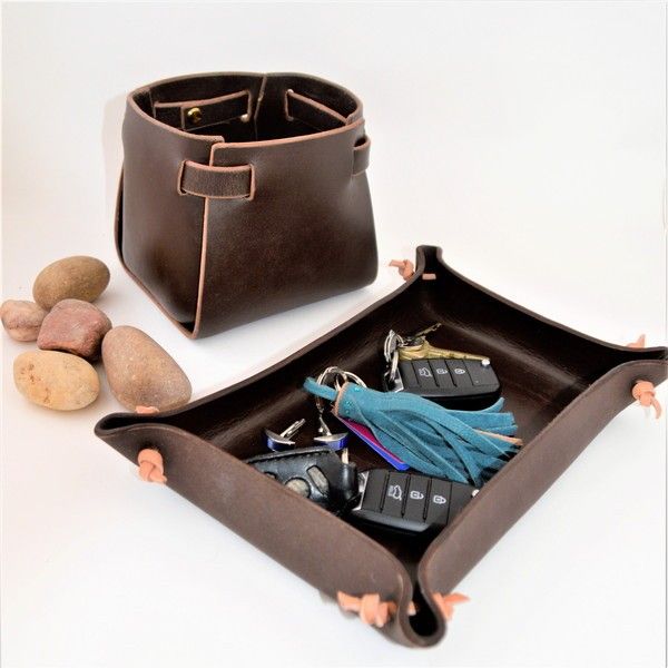 Bridle leather plant pot holder and moulded valet tray.