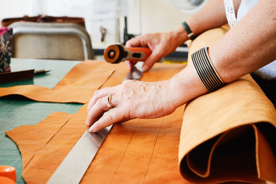 cutting the leather with rotary cutters