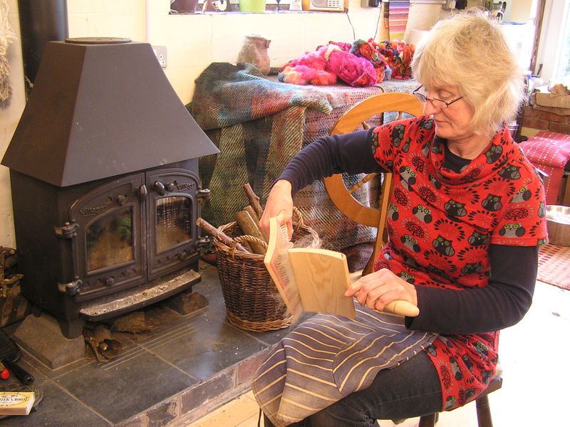 Fiona carding fleece in her studio