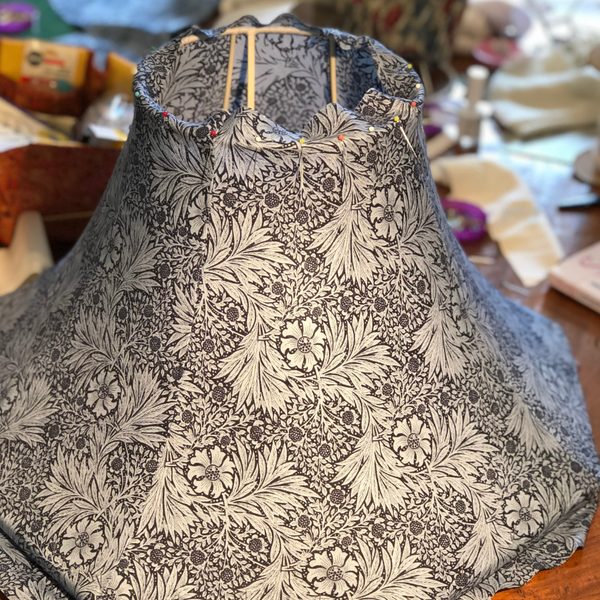 Pining a traditional handmade tailored lampshade in a William Morris design