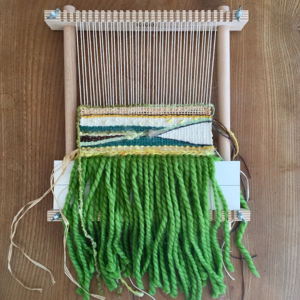 Green wall hanging on the loom