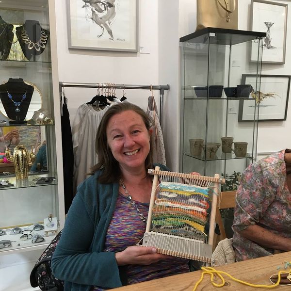 Student with woven piece