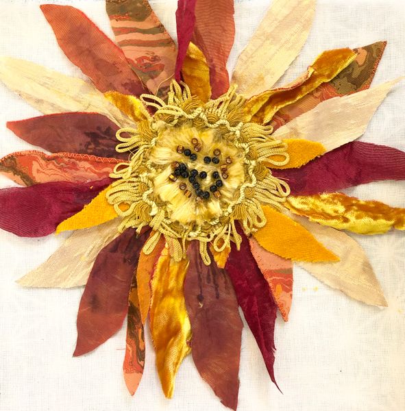 Philippa’s sunflower picture made with fabrics, braid, free-machine embroidery & hand sewn beads