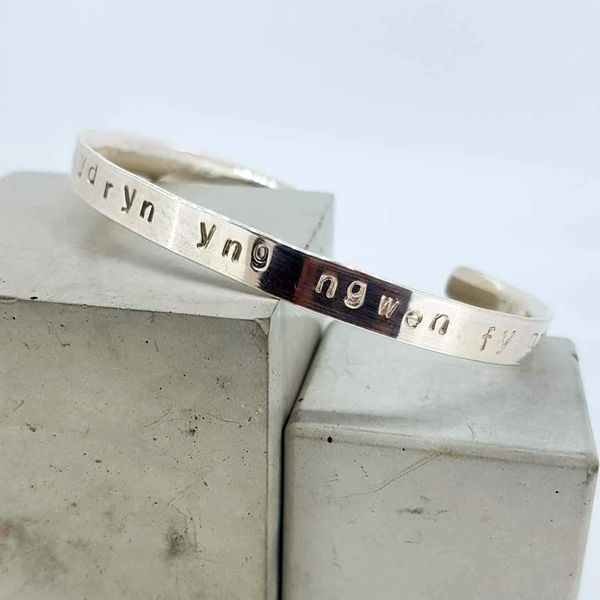 beautiful welsh words on a personalised bangle made at a silver ring, cuff and bangle making workshop