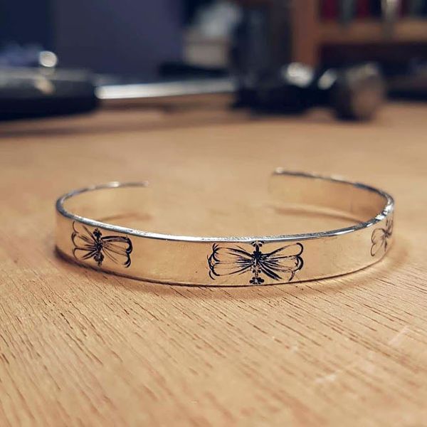 Bee cuff made by a student who got creative with the personalisation stamps